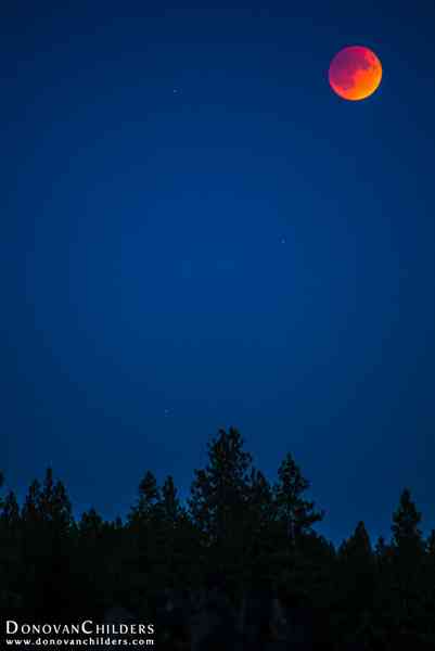 Lunar Eclipse at 'Umbra' (mid-eclipse). Stars are also becoming visible.